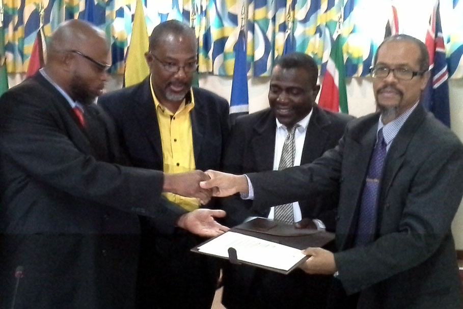 Minister Bhola presents signed declaration to CRFM Executive Director