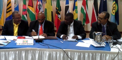 Signing (l to r):  Hon. Luther Buchanan of Jamaica, Hon. Roland Bhola of Grenada, Hon. Johnson Drigo of Dominica and CRFM Executive Director Milton Haughton