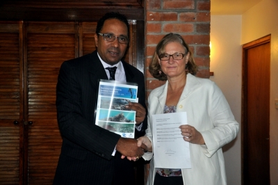 Dr. Kenneth Darroux, Minister of the Environment, Natural Resources, Physical Planning and Fisheries and First Secretary, High Commission Australia Lydia Bezeruk after signing off on the plan.